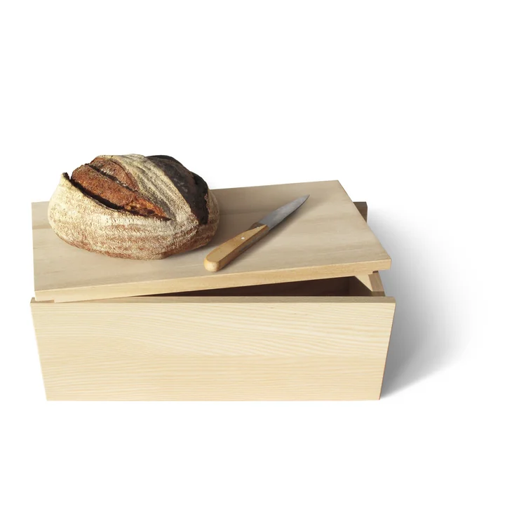 La boîte à pain fonctionnelle Moin ! de side by side avec un pain sur le couvercle