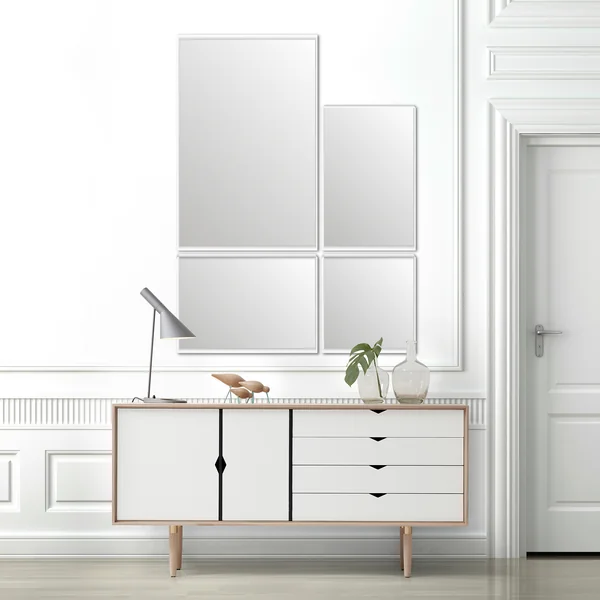 Le miroir mural VertiMirror de Verti Copenhagen au-dessus d'un sideboard blanc